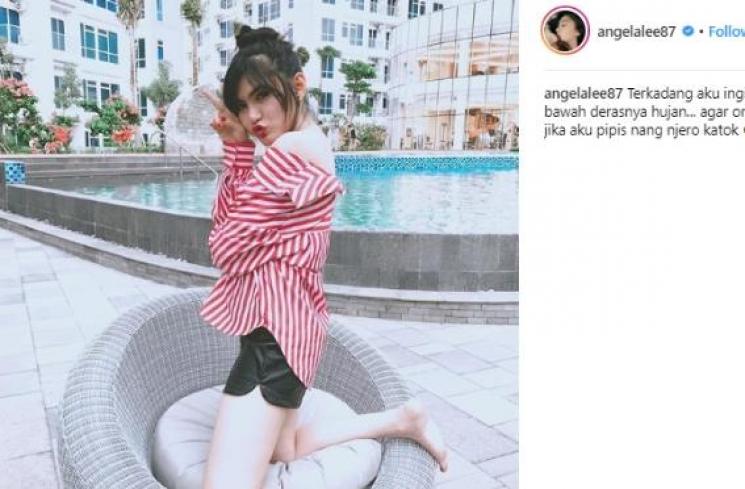 Angela Lee dengan kemeja dan hotpants.(Instagram/@angelalee87)